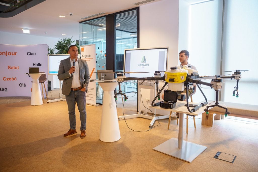 AgriCloud founder, Marcel Ionescu, and the showcased drone; photo by Orange Romania