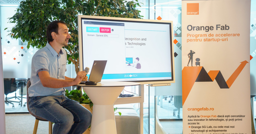 Horia Cucu, CEO and co-founder, with a demo of the Zevo Tech speech transcription solution; photo by Orange Romania