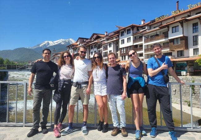 Bansko Nomads together in front of the mountain