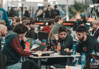 group of tech enthusiasts and ethical hackers working together at cybersecurity conference Defcamp