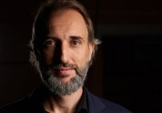 A portrait picture of the CEO of Digital Lights Dimitar Dimitrov on a black background with a light on the left corner