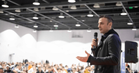 Football Star Dimitar Berbatov speaks in front of a crowd of high school students