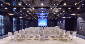 CEE startup events in 2023 showing an empty conference room with chairs and large screen