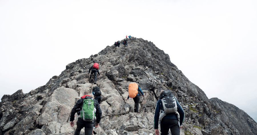 Mountain climbing requires keeping your eyes fixed on the way to the top, without forgetting to look at your feet. Same goes with driving a company's sustainability strategy. Photo source: Unsplash